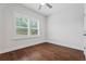 Hardwood floors, plantation shutters, and neutral paint in the bedroom at 775 Hadley Ne Ln, Marietta, GA 30068