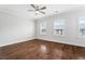 Spacious bedroom with hardwood floors, ceiling fan, neutral paint, and abundant natural light at 775 Hadley Ne Ln, Marietta, GA 30068
