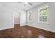 Bright bedroom featuring hardwood floors, large windows with wood shutters, and ceiling fan at 775 Hadley Ne Ln, Marietta, GA 30068
