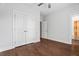 Bedroom with hardwood floors, a double door closet, and an ensuite bathroom at 775 Hadley Ne Ln, Marietta, GA 30068