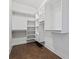 Walk-in closet with custom shelving for ample storage and organization at 775 Hadley Ne Ln, Marietta, GA 30068