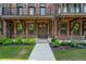 Inviting brick townhome featuring a walkway to the front door and greenery at 775 Hadley Ne Ln, Marietta, GA 30068