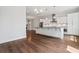 Bright, open kitchen features hardwood floors, white cabinets, stainless appliances, and a large center island at 775 Hadley Ne Ln, Marietta, GA 30068