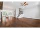 Open floor plan featuring hardwood floors, ceiling fan, staircase, and kitchen view at 775 Hadley Ne Ln, Marietta, GA 30068