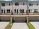 Rear view of the townhomes with private decks and drive under garages at 775 Hadley Ne Ln, Marietta, GA 30068