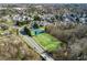 Aerial view of the community featuring tennis courts and green space with mature trees and landscaping at 200 Ennisbrook Se Dr, Smyrna, GA 30082
