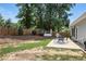 Large, private backyard featuring a patio, dining set, grill, deck, and wood fence at 200 Ennisbrook Se Dr, Smyrna, GA 30082