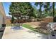 The backyard has a stone patio with a dining set and a stainless steel grill at 200 Ennisbrook Se Dr, Smyrna, GA 30082