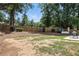 Huge backyard featuring a grill and dining area and a raised deck with blue Adirondack chairs at 200 Ennisbrook Se Dr, Smyrna, GA 30082