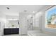 Bright bathroom featuring double vanity, soaking tub, and glass enclosed shower at 200 Ennisbrook Se Dr, Smyrna, GA 30082