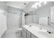Bright bathroom with a double sink vanity, white tile, and a shower/tub combo at 200 Ennisbrook Se Dr, Smyrna, GA 30082