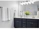 Bathroom vanity featuring double sinks and white countertop at 200 Ennisbrook Se Dr, Smyrna, GA 30082