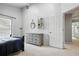 Bedroom featuring a dresser and a view into an ensuite bathroom at 200 Ennisbrook Se Dr, Smyrna, GA 30082