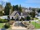 View of the neighborhood clubhouse featuring stone accents, manicured landscaping and elegant entryway at 200 Ennisbrook Se Dr, Smyrna, GA 30082