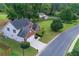 Aerial view of a two-story home with a brick front, attached garage, and well-maintained lawn at 200 Ennisbrook Se Dr, Smyrna, GA 30082