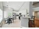 Modern kitchen with stainless steel appliances, breakfast bar, and adjacent dining area at 200 Ennisbrook Se Dr, Smyrna, GA 30082