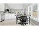 Stylish kitchen with granite countertops, stainless steel appliances, and cozy breakfast nook at 200 Ennisbrook Se Dr, Smyrna, GA 30082