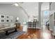 Bright, open-concept living room with hardwood floors and vaulted ceilings at 200 Ennisbrook Se Dr, Smyrna, GA 30082