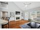 Spacious living room with fireplace, built-in shelving, and vaulted ceilings at 200 Ennisbrook Se Dr, Smyrna, GA 30082