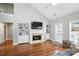 Bright living room with fireplace, built-in shelves, and high ceilings at 200 Ennisbrook Se Dr, Smyrna, GA 30082