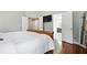 Serene main bedroom features hardwood floors, neutral tones, and ensuite bathroom at 200 Ennisbrook Se Dr, Smyrna, GA 30082