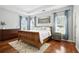 Comfortable main bedroom with natural light, hardwood floors, and ample space for relaxation at 200 Ennisbrook Se Dr, Smyrna, GA 30082