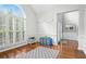 Bright playroom with shuttered windows, hardwood floors, and ample space for fun and games at 200 Ennisbrook Se Dr, Smyrna, GA 30082
