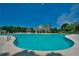 Community pool with comfortable lounge chairs and manicured landscaping at 200 Ennisbrook Se Dr, Smyrna, GA 30082