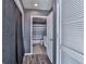 Bathroom area with open door leading to a shower with a striped curtain at 361 17Th St # 1121, Atlanta, GA 30363