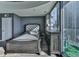 Bedroom featuring wood floors, a balcony overlooking city views, and gray color palette at 361 17Th St # 1121, Atlanta, GA 30363