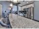 Modern kitchen featuring stainless steel appliances, island seating, and granite countertops at 361 17Th St # 1121, Atlanta, GA 30363