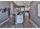 Kitchen area with white cabinets, stainless steel appliances, breakfast bar, and hardwood flooring at 361 17Th St # 1121, Atlanta, GA 30363