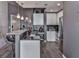 Stylish kitchen features stainless steel appliances, bar seating, granite countertop, and pendant lighting at 361 17Th St # 1121, Atlanta, GA 30363