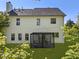 A backyard featuring a two-story house and a modern pergola at 429 Tannenhill Pl, Sugar Hill, GA 30518