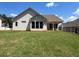Large, level backyard, perfect for outdoor activities with a view of the home's back exterior at 341 Brooke View Trail, Canton, GA 30115