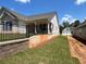 The backyard features a sturdy retaining wall and a view of the home's rear exterior at 341 Brooke View Trail, Canton, GA 30115