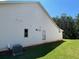 A side view of the new home reveals classic white siding and a well-maintained green lawn at 341 Brooke View Trail, Canton, GA 30115