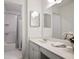 Bright bathroom with white cabinets and shower and tub combination at 5 Palace Green Place Nw, Atlanta, GA 30318