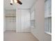 Bedroom with ceiling fan, large windows, and closet at 5 Palace Green Place Nw, Atlanta, GA 30318