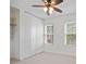 Bedroom with ceiling fan, large windows, and large closet at 5 Palace Green Place Nw, Atlanta, GA 30318