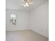Bright bedroom with large window and ceiling fan at 5 Palace Green Place Nw, Atlanta, GA 30318