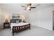 Bedroom with a ceiling fan, closet, and end tables with lamps at 5 Palace Green Place Nw, Atlanta, GA 30318