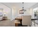 Dining room features a chandelier and custom table with bench seating at 5 Palace Green Place Nw, Atlanta, GA 30318