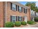 Traditional brick home with black shutters and well-manicured landscaping at 5 Palace Green Place Nw, Atlanta, GA 30318