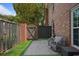 Brick patio with a fenced yard and seating at 5 Palace Green Place Nw, Atlanta, GA 30318