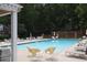 Inviting community pool surrounded by lounge chairs for relaxing and enjoying the outdoors at 5 Palace Green Place Nw, Atlanta, GA 30318