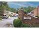 Picturesque street view of Palace Green Place, showcasing charming brick townhomes and mature trees at 5 Palace Green Place Nw, Atlanta, GA 30318