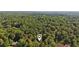 Stunning aerial perspective of a home nestled within a lush forest canopy at 205 Pine Lake Dr, Cumming, GA 30040