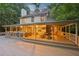 Spacious screened-in porch, with outdoor dining space and large deck overlooking yard at 205 Pine Lake Dr, Cumming, GA 30040