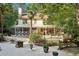 The backyard boasts an entertainment space with a deck, and screened-in patio, creating the perfect atmosphere at 205 Pine Lake Dr, Cumming, GA 30040